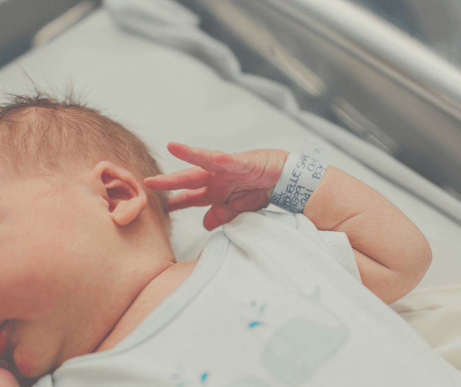 a newborn baby with a hospital admissions wristband